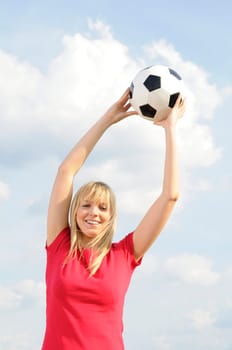 Young woman with soccer ball
