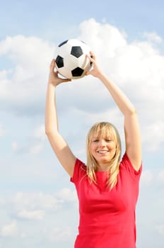 Young woman with soccer ball