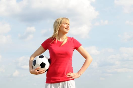 Young woman with soccer ball