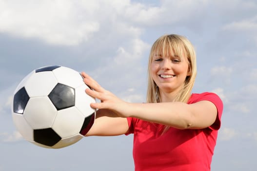 Young woman with soccer ball
