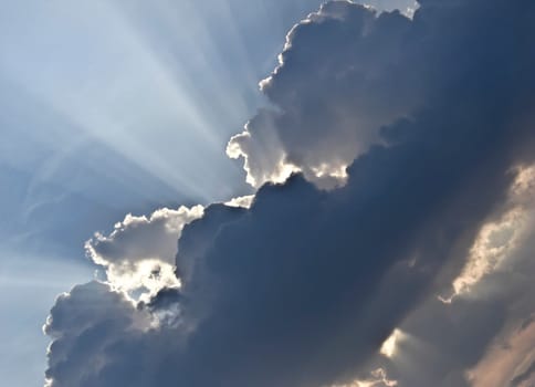 Sunbeam behind dark Clouds after a stormy weather