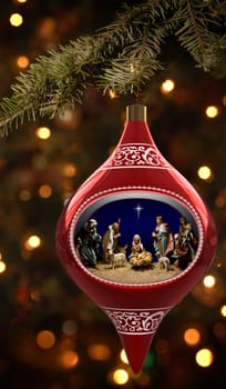 Christmas ornament featuiring a diorama of the nativity