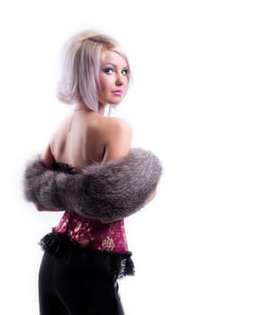 Sexy  blond girl in corset and fur boa look at you isolated