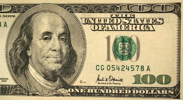 The Front half of a one hundred dollar bill