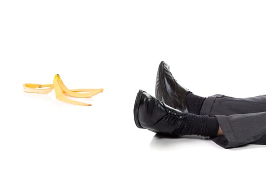 A scene of a slip and fall accident with banana peel. Isolated on white background