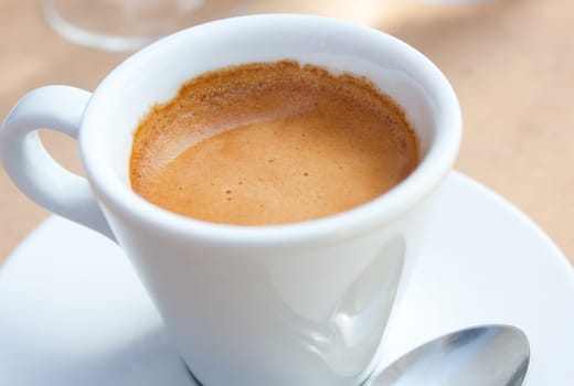 Close-up view of a white cup of coffee, espresso