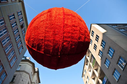 streets in the first district are decorated with red christmas ball ornament in the shopping streets