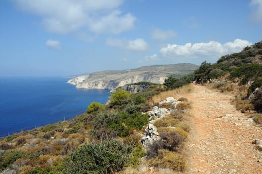 Windswept coastal ridges ionian sea and sky horizon. Keri lighthouse Zakynthos, Greece.