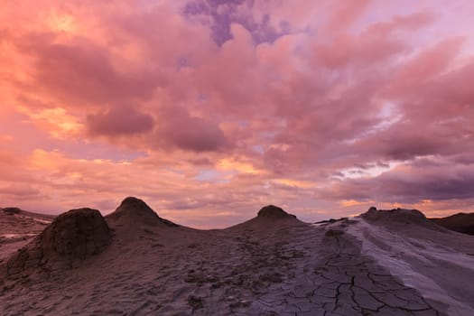 Mud Volcanoes and a sky with clouds in Buzau, Romania