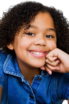 Girl smiling with her hand on chin isolated over white