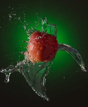 Water Splashes on Red Apple