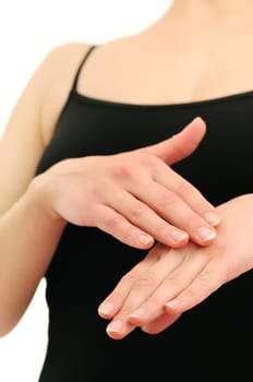 Woman in underwear applies cream on dry hands