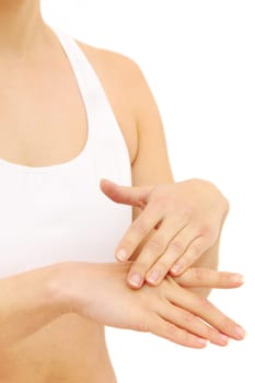 Woman in underwear applies cream on dry hands