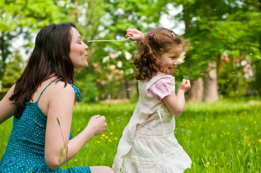 Mother with small child playing outdoors
