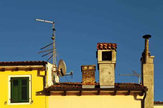 Roofscape with chimney and antennas