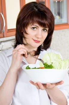 Beautiful a woman  to taste  cooked the food