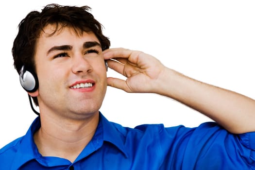 Close-up of a man listening to music on a headphones isolated over white
