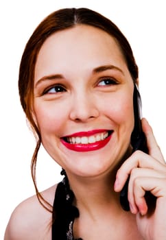 Gorgeous woman talking on a mobile phone isolated over white