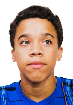 Close-up of a teenage boy day dreaming isolated over white