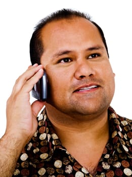 Mixedrace man talking on a mobile phone isolated over white