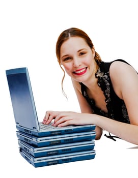 Caucasian woman using a laptop and smiling isolated over white