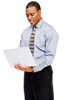 Businessman using a laptop and smiling isolated over white