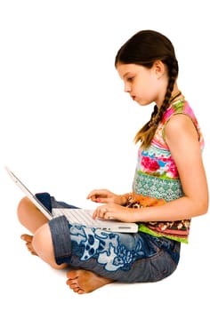 Caucasian girl using a laptop and posing isolated over white