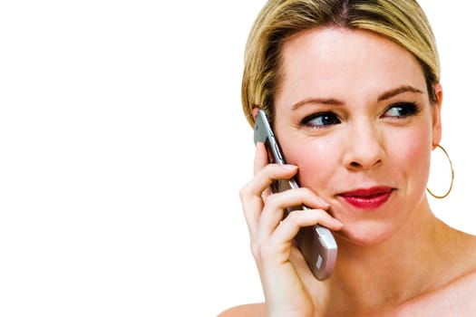 Mid adult woman talking on a mobile phone isolated over white