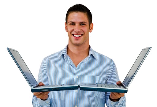 Happy man holding laptops and posing isolated over white