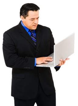 Businessman working on a laptop isolated over white