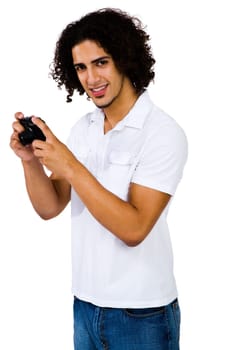 Handsome man photographing with a camera and smiling isolated over white