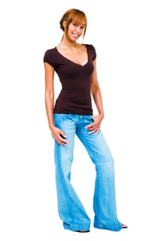 Young woman standing with her hands in her pockets isolated over white
