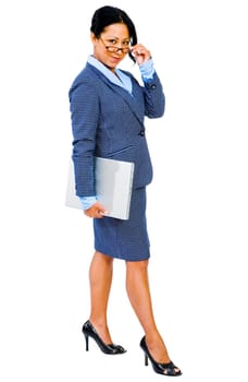 Woman holding a laptop and smiling isolated over white