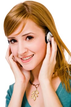 Confident woman wearing headphones and listening to music isolated over white