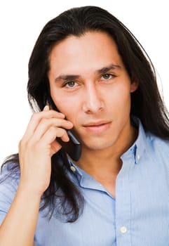 Young man talking on a mobile phone isolated over white
