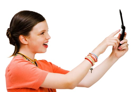 Smiling girl text messaging on a mobile phone isolated over white