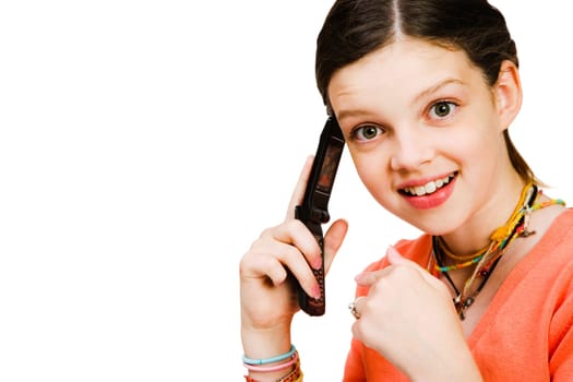 Girl talking on a mobile phone isolated over white