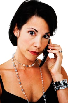 Portrait of a woman talking on a mobile phone isolated over white