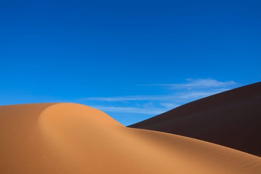 Sahara desert sand dunes with clear blue sky. Concept for traveling and adventure holidays. See more of my beautiful desert images in my portfolio.
