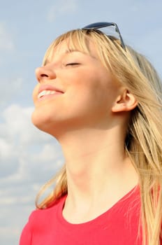 Laughing young woman in sunglasses