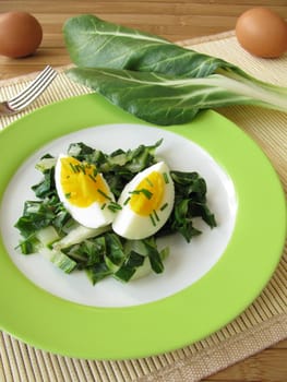 Eggs on chard vegetables