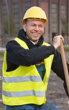 Laughing construction worker in yellow hard hat