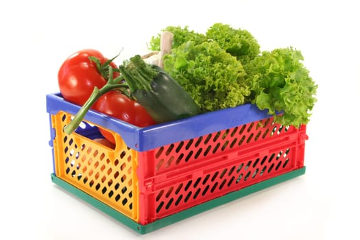 a folding box filled with different vegetables