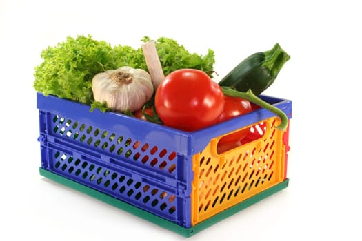 a folding box filled with different vegetables
