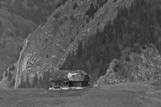 an old abandoned house near a mountain
