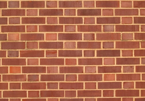 Old brick exterior wall with Red and brown duo-sized bricks.