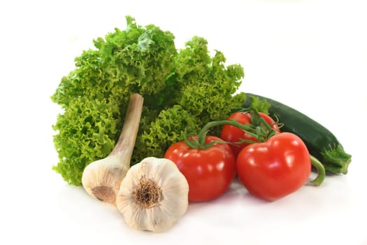 Different vegetables against a white background