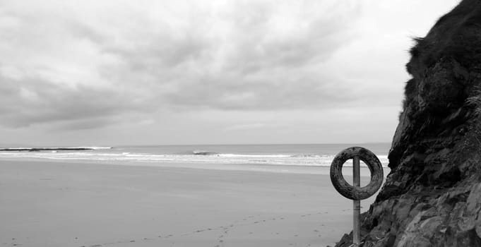 A tyre on a pole on the west coast of Ireland in black and white