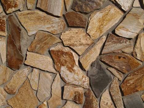 Multi-colored flat stone facade on a building