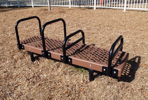 dip, bench, bench dip, brown, black, outdoor, outside, exercise, equipment, exercise equipment, park, fitness, sports, train, training, work, out, workout, work-out, hand, rails, handrail, hand-rail, hand rail, metal,